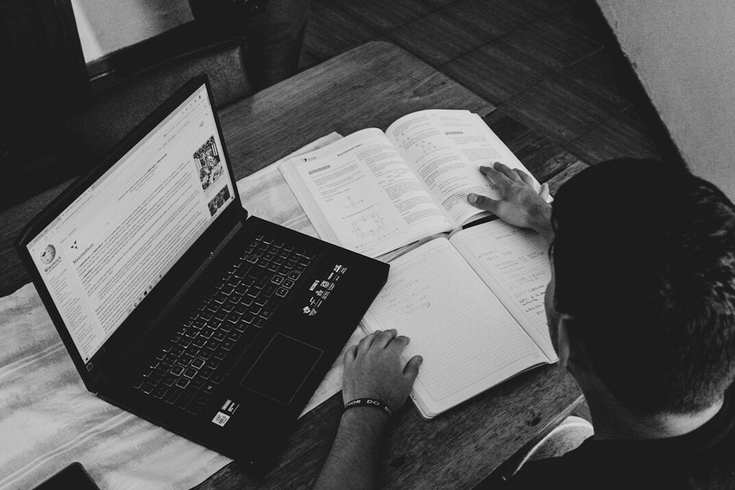 man studying online course
