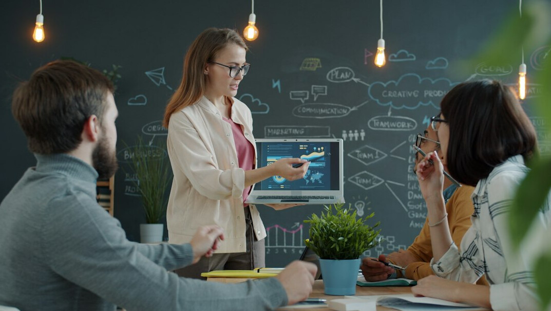 woman leading business presentation
